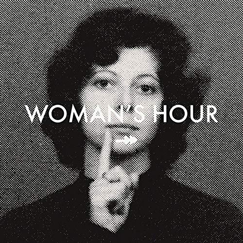 Black and white halftone portrait of a woman holding a finger to her lips.