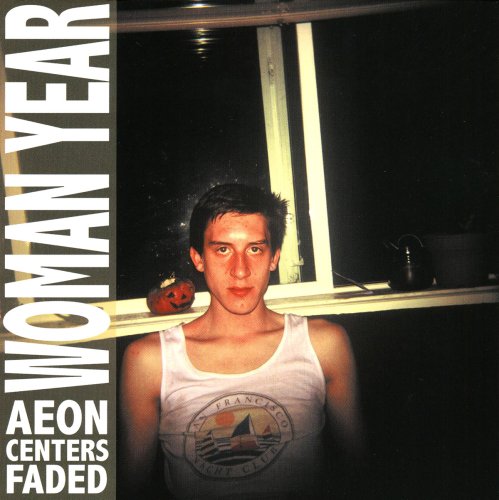 CD cover: Man in tank top stands before a window.