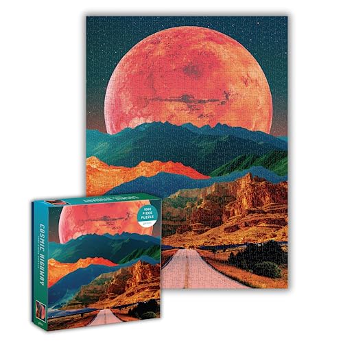Completed jigsaw puzzle depicting a red moon over mountains and desert landscape.