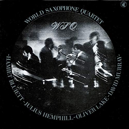 Black and white album cover featuring four saxophone players in a circle.