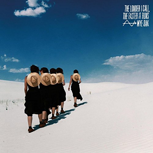 Album cover: group walking away in a white, sandy landscape.