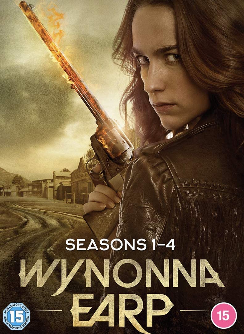 Wynonna Earp holding a flaming revolver against a Western town background on DVD cover.