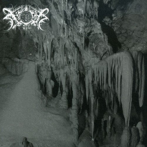 Black and white photo of a dark cave interior with stalactites and Xasthur logo.