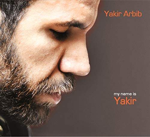 CD cover featuring a close-up portrait of a man with a beard.