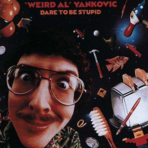 “Weird Al” Yankovic album cover with floating objects and a large face.
