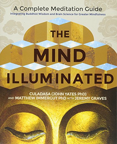 Book cover featuring a golden Buddha statue and geometric cube patterns on a background.