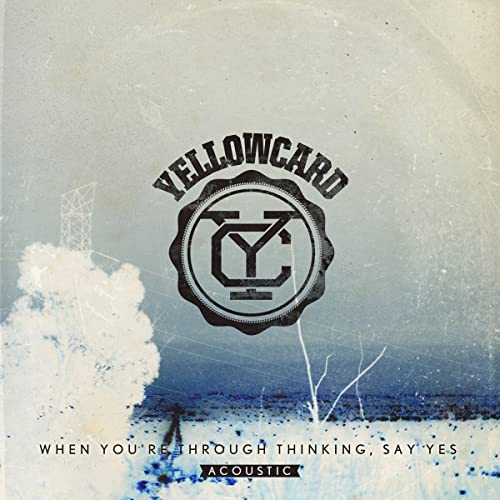 Yellowcard album cover: textured blue background, logo, and sparse trees.