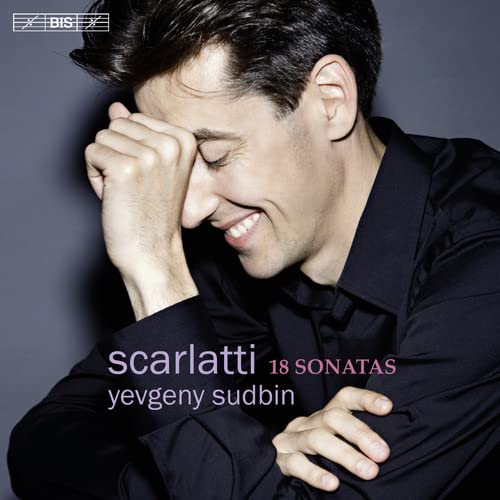 CD cover featuring pianist Yevgeny Sudbin with closed eyes, smiling.