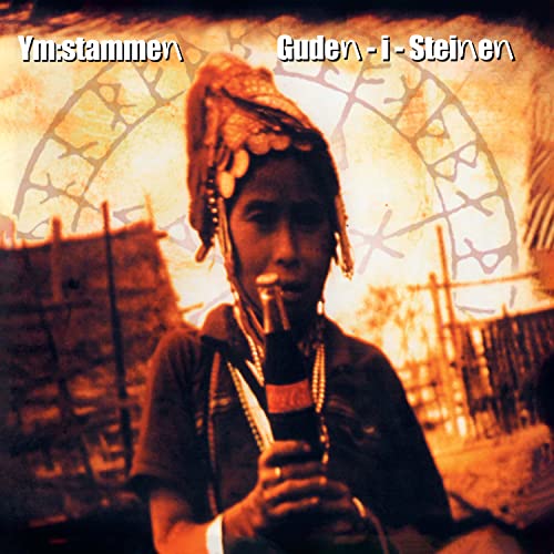 CD cover: portrait of a man with dreadlocks holding a bottle.