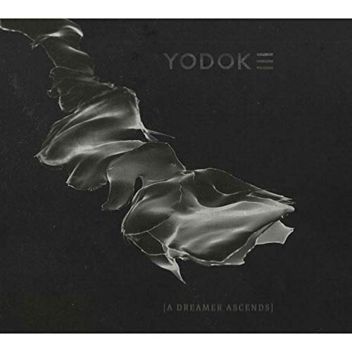 "Black album cover with silver, wavy design and 'Yodok III' and 'A Dreamer Ascends' text."