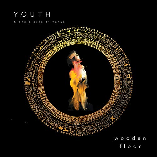 Black album cover with gold circular design and central figure.