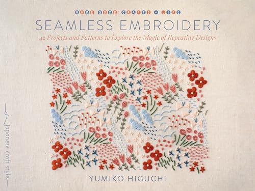 Book cover featuring red and blue floral embroidery on a cream fabric background.