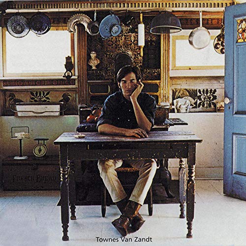 Townes Van Zandt album cover: man at a table in a rustic room.