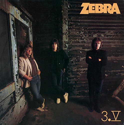 Album cover for Zebra’s “3V” featuring three men in front of a wooden wall.