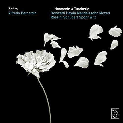 CD cover: white flower petals and bloom on black background.