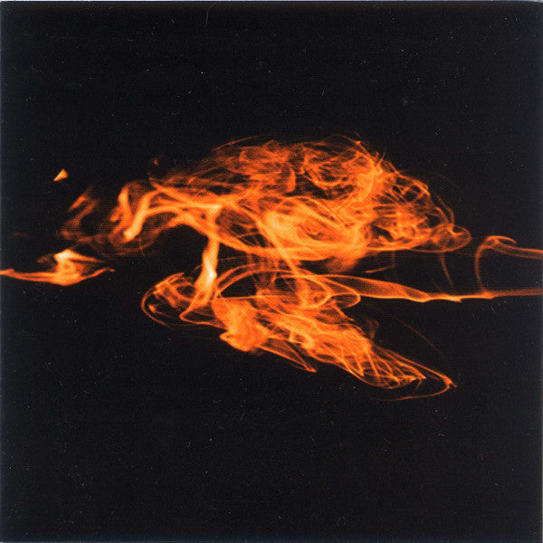 Abstract orange swirls resembling flames against a dark background.