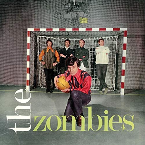 The band The Zombies posing in front of a handball goal with a basketball.