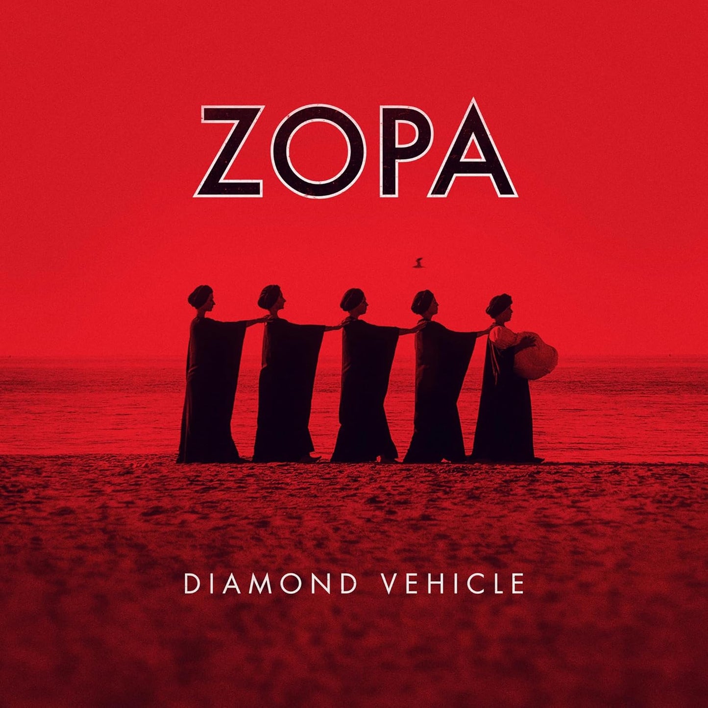 Red album cover with silhouetted figures on a beach, text āZOPA Diamond Vehicleā.
