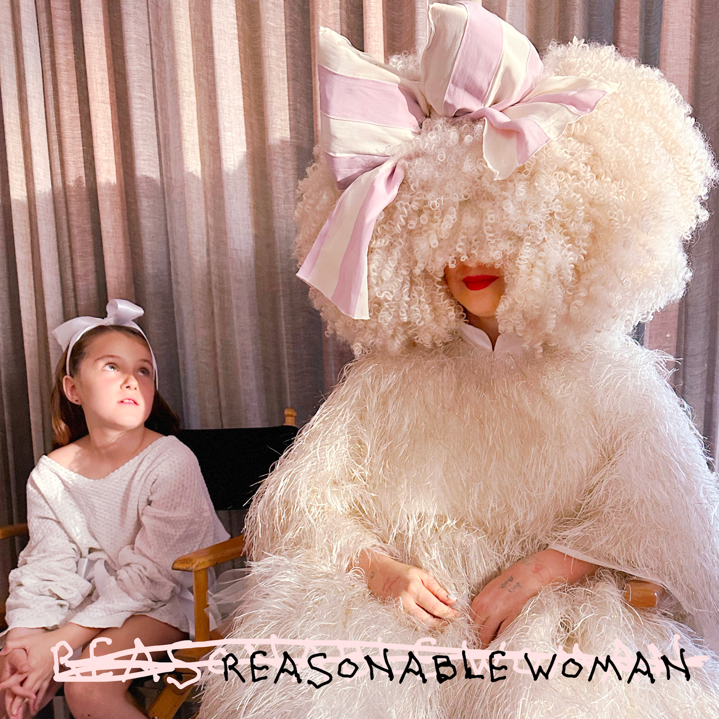 Sia album cover: artist in large white wig with a child nearby.