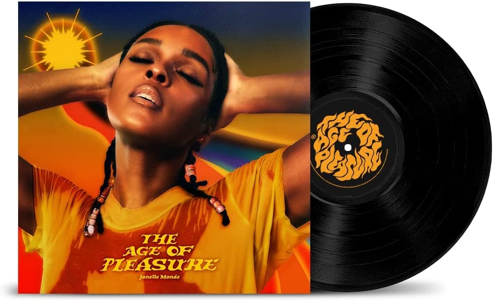 Janelle Monáe album cover and black vinyl record with orange label.