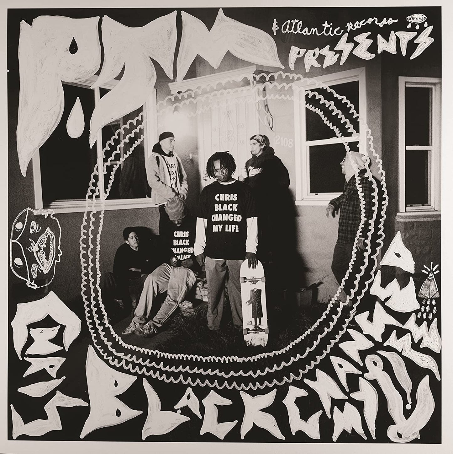 "Black and white album cover with band members inside a wavy oval frame."