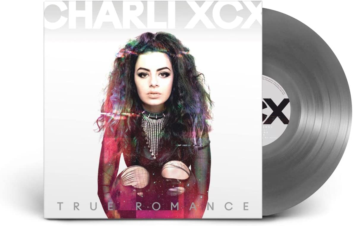 Album cover with Charli XCX and silver vinyl record partially visible behind it.