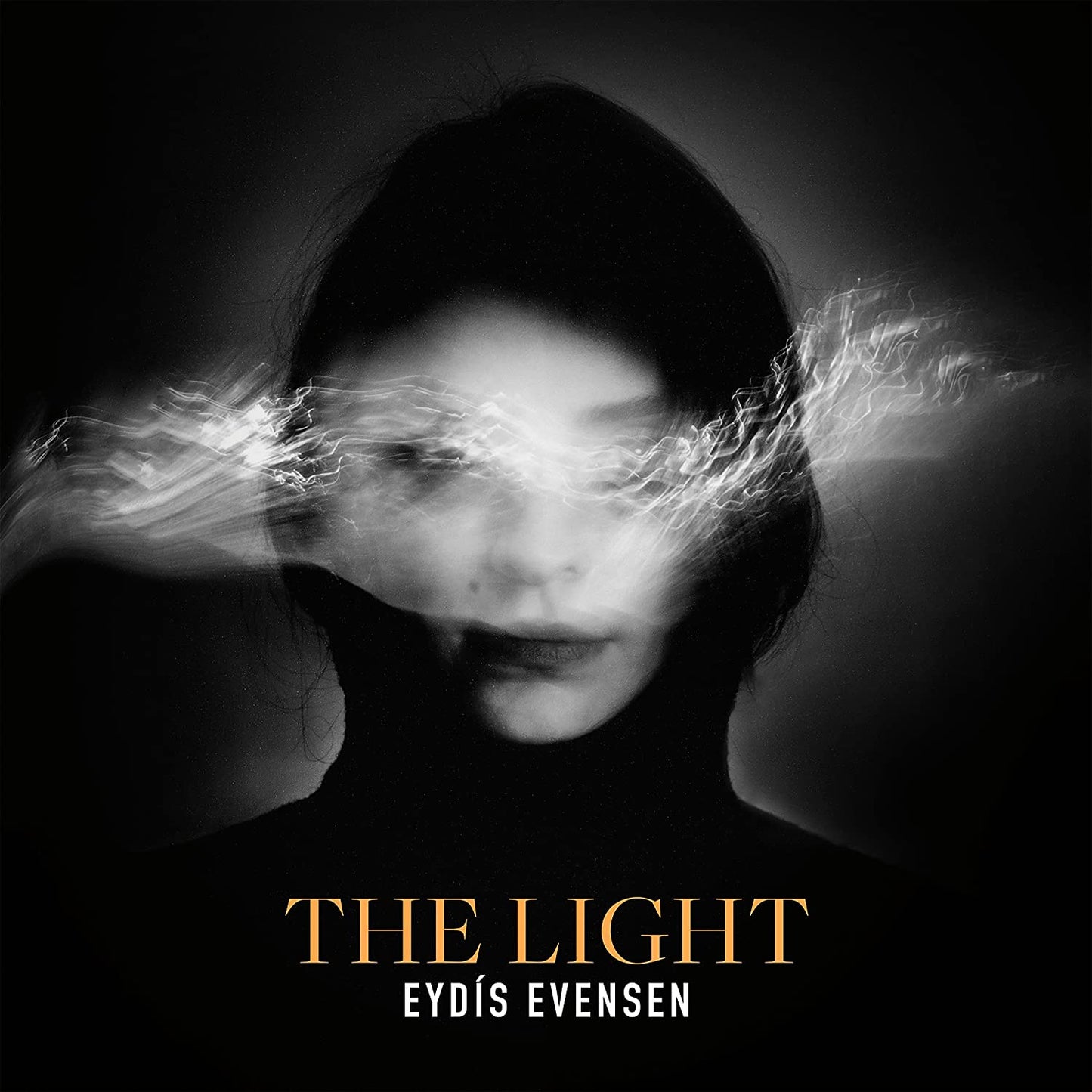 Black and white portrait of a woman with light streaks obscuring her eyes.