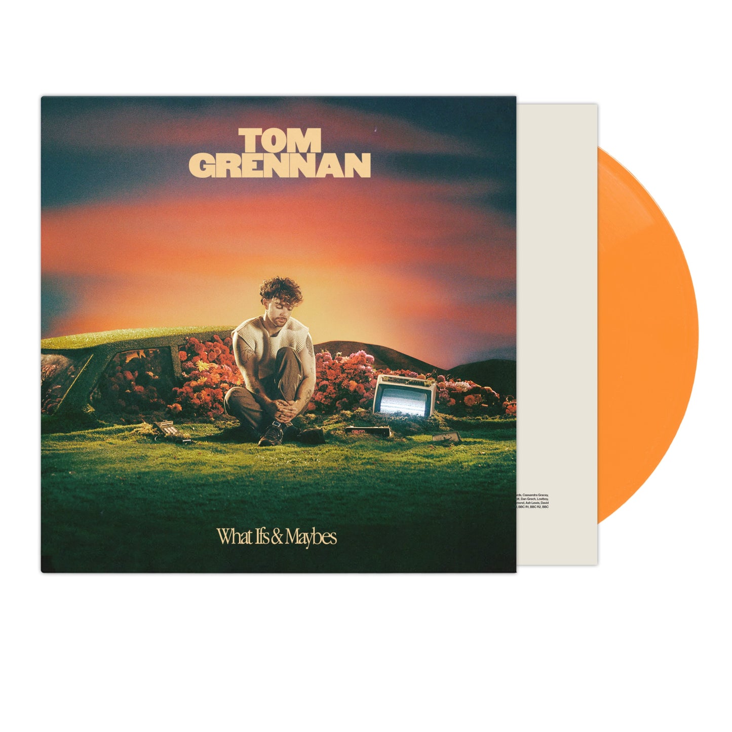 "Tom Grennan's 'What Ifs & Maybes' vinyl record with orange disc and album cover."