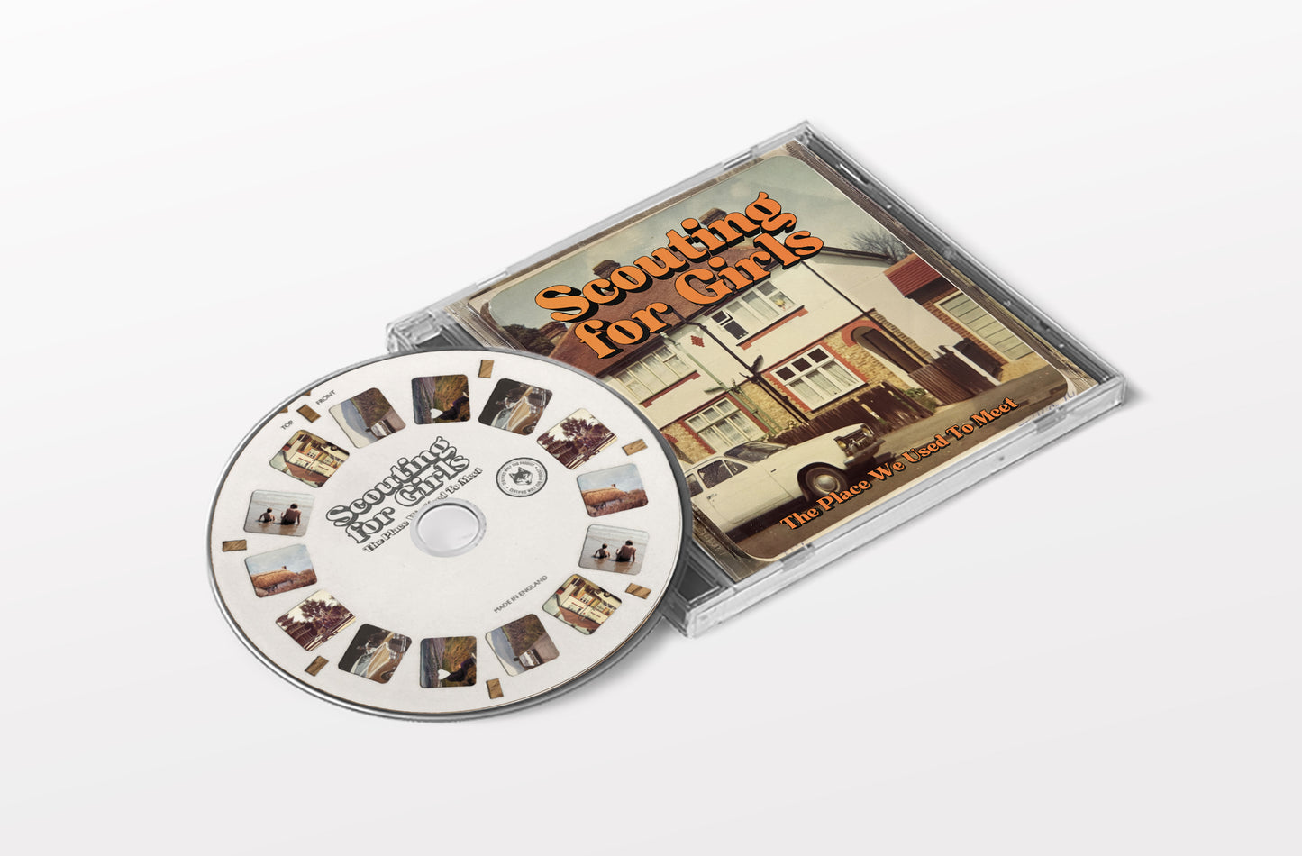 "CD case with disc, featuring 'Scouting for Girls' album cover and title on disc."