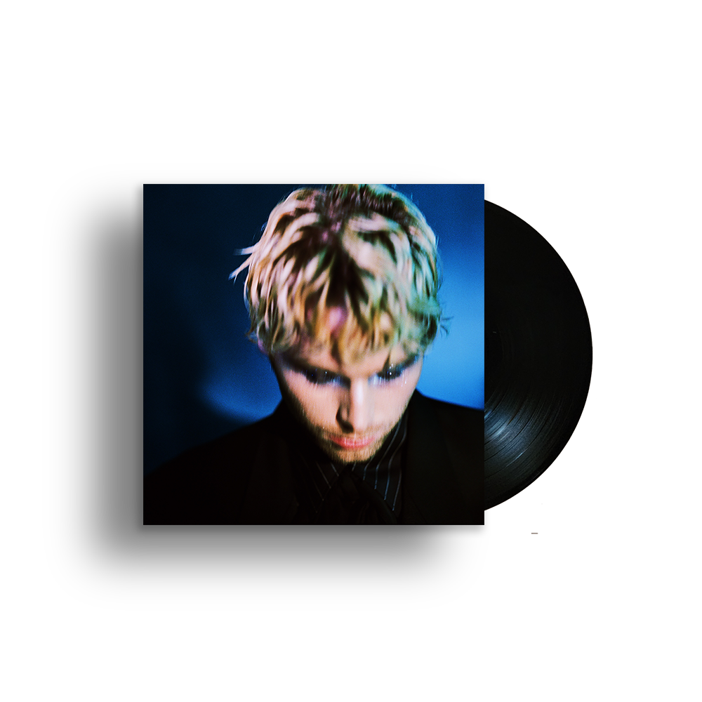Vinyl record with cover art featuring a young man with blonde hair.