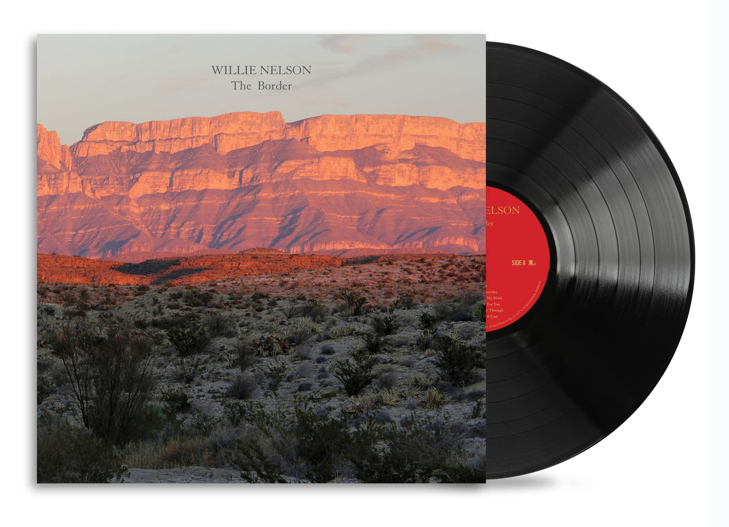 Willie Nelson’s “The Border” vinyl record with desert landscape cover art.
