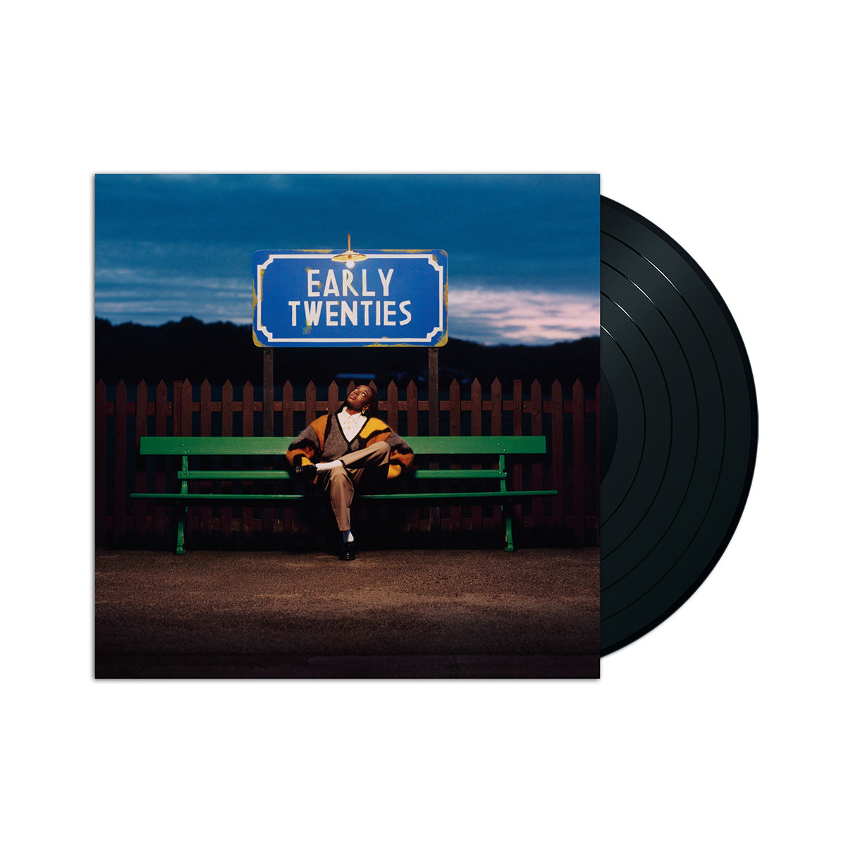 Album cover for Cat Burns’ “Early Twenties” with a person on a bench.
