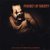 Image of Walter Trout CD cover with a man holding a guitar, blurry on a black background.