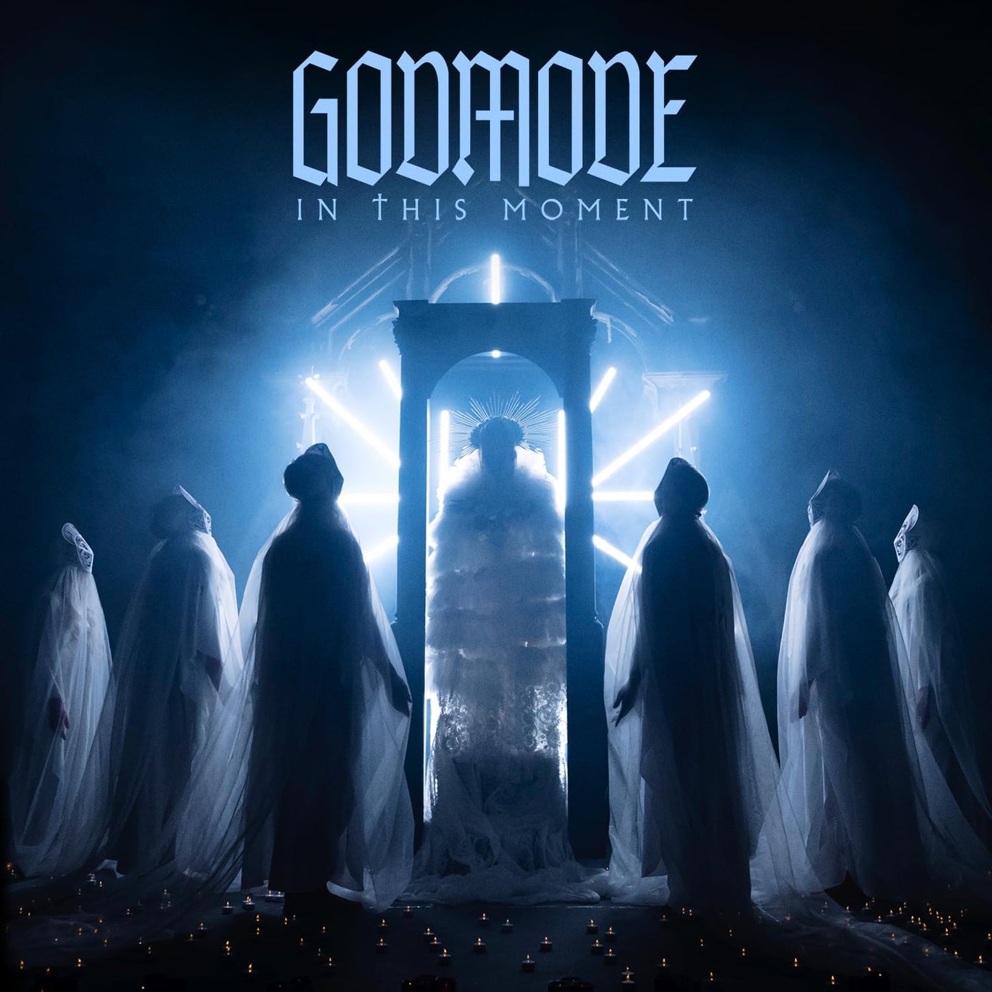 "CD album cover with robed figures and a glowing figure in an archway."