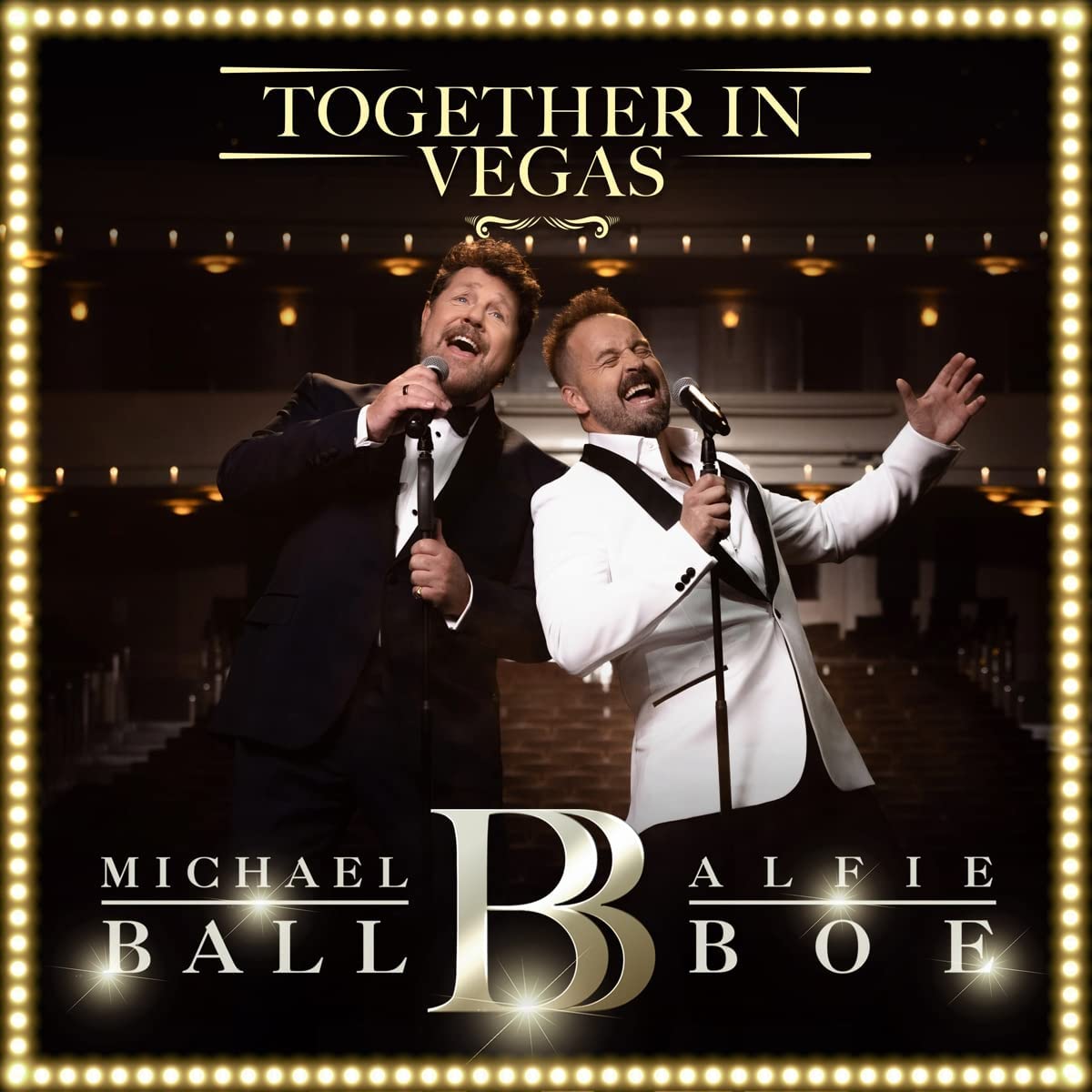 Alfie Boe and Michael Ball on stage, album cover with gold border.
