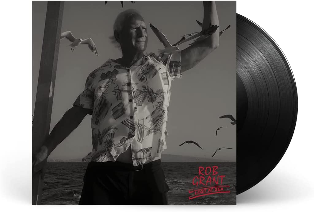 Black and white album cover with a man, birds, and a vinyl record.
