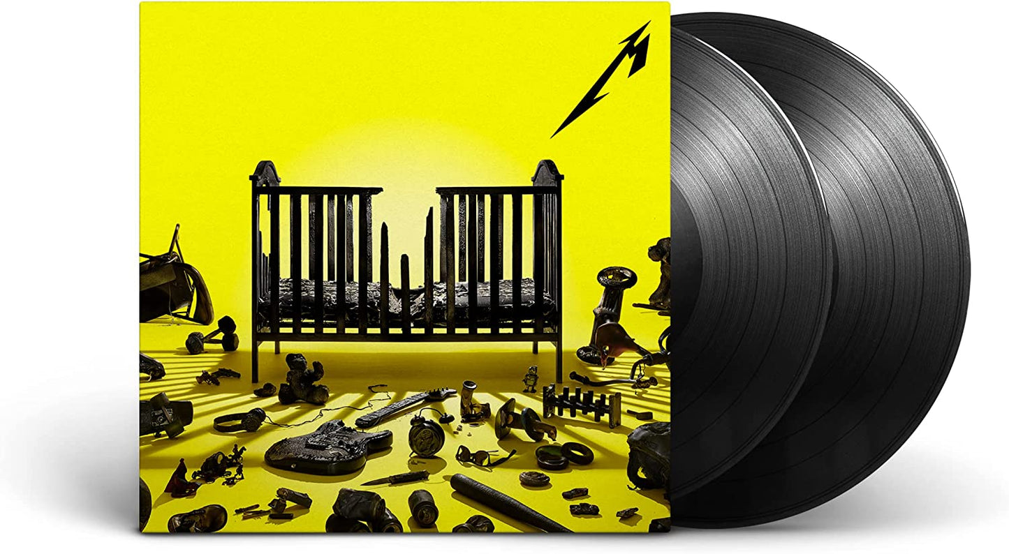 "Black vinyl record with yellow album cover featuring a crib and various objects."
