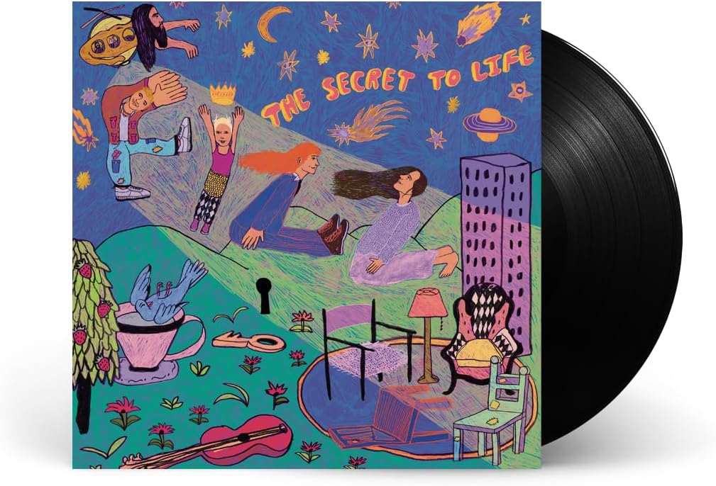 Vinyl record with colorful, whimsical cover art featuring people and fantastical elements.