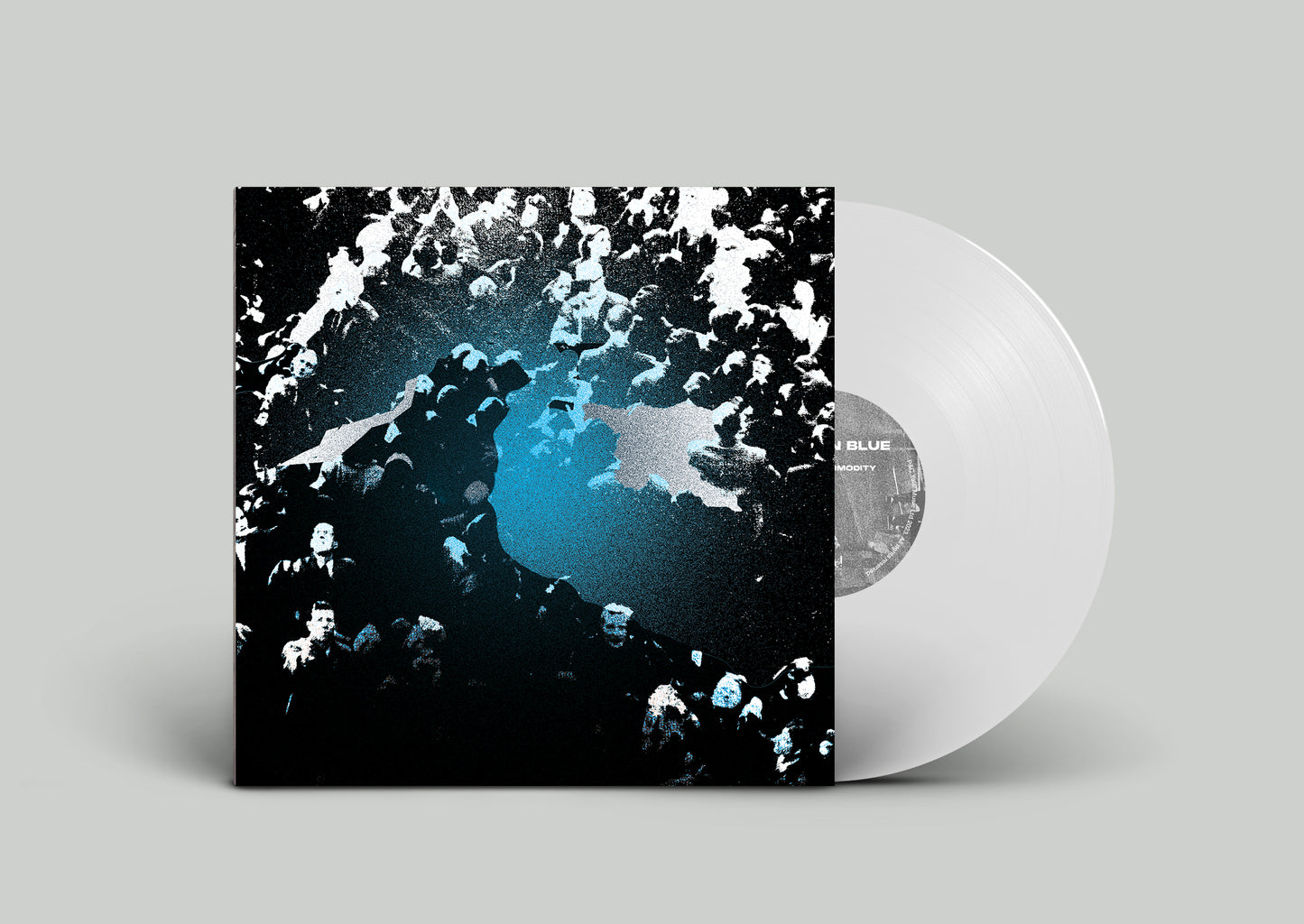 "Vinyl record with white disc and black cover featuring abstract blue and white design."