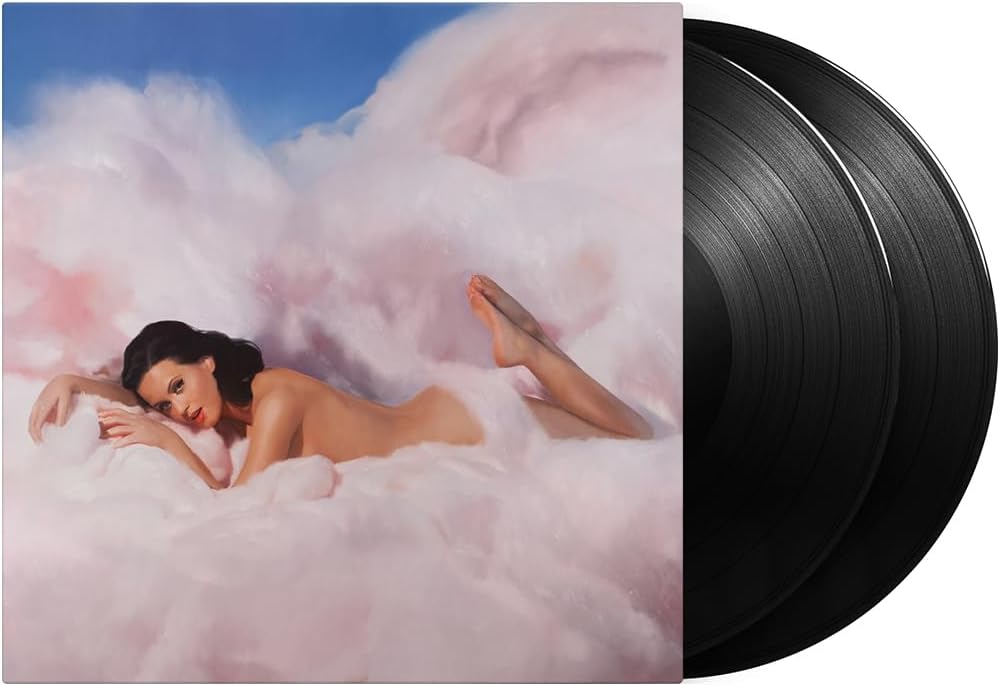 "Katy Perry lying on fluffy clouds, beside two black vinyl records on a white background."