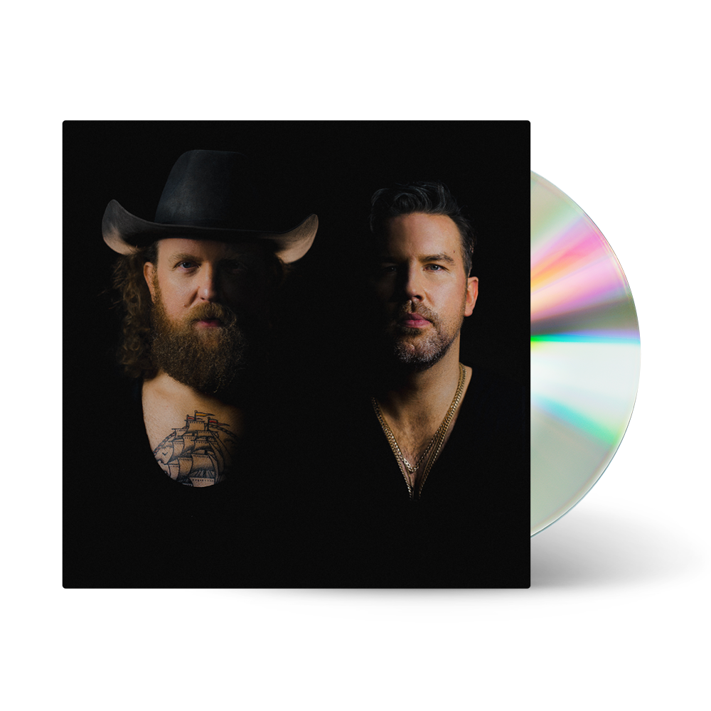 "CD case with two men, one wearing a cowboy hat, on black background."
