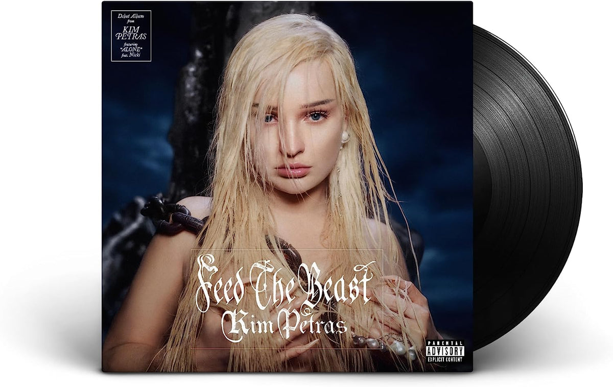 Kim Petras album cover on black vinyl record, portrait of singer.
