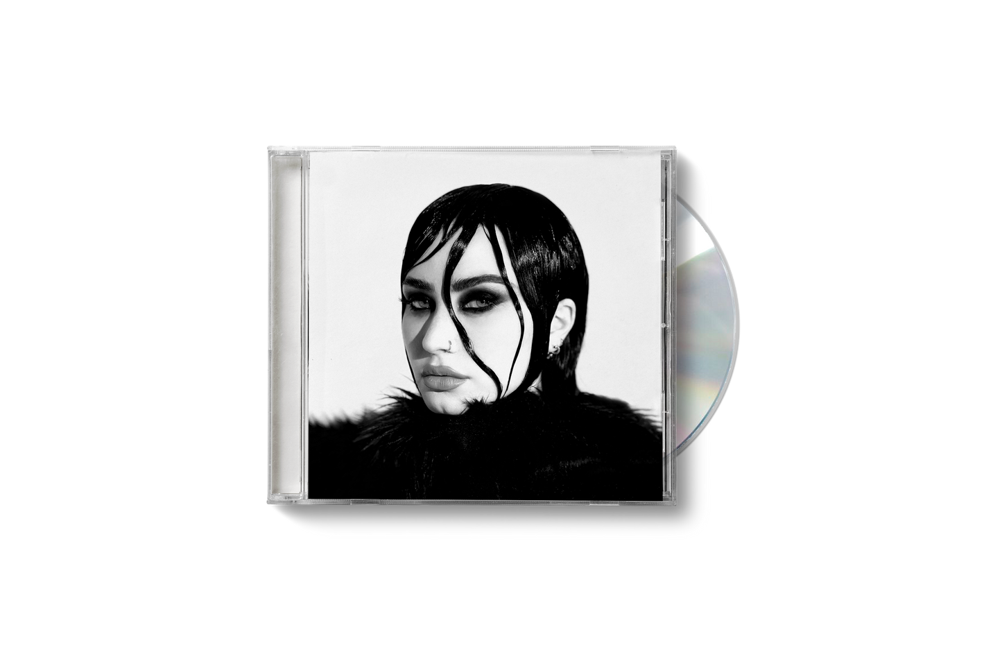 "Demi Lovato CD case with black and white cover art and partially visible disc."