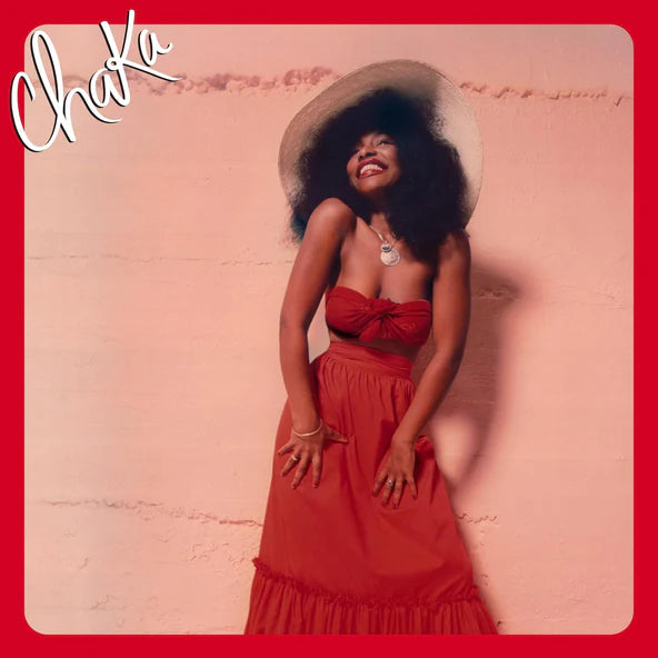 Chaka Khan album cover: woman in red dress with large afro, smiling.