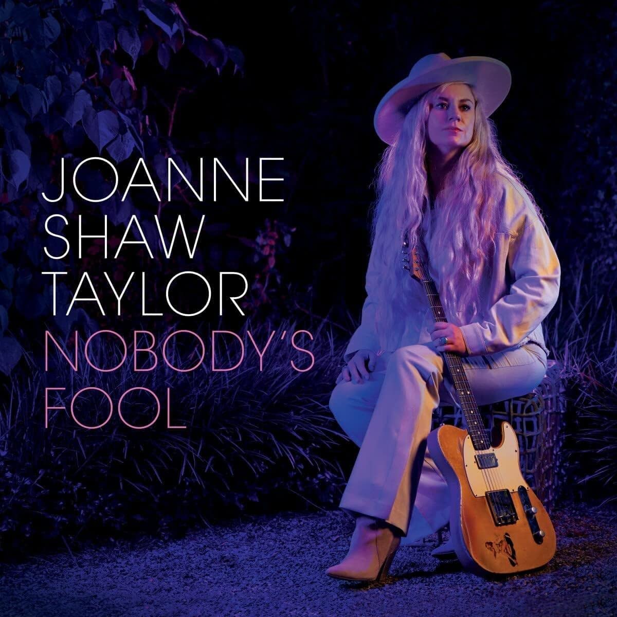 Joanne Shaw Taylor album cover, woman with guitar and hat.