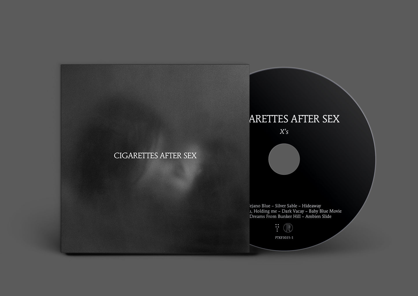 Black CD with white text: āCigarettes After Sex - Xsā and tracklist.