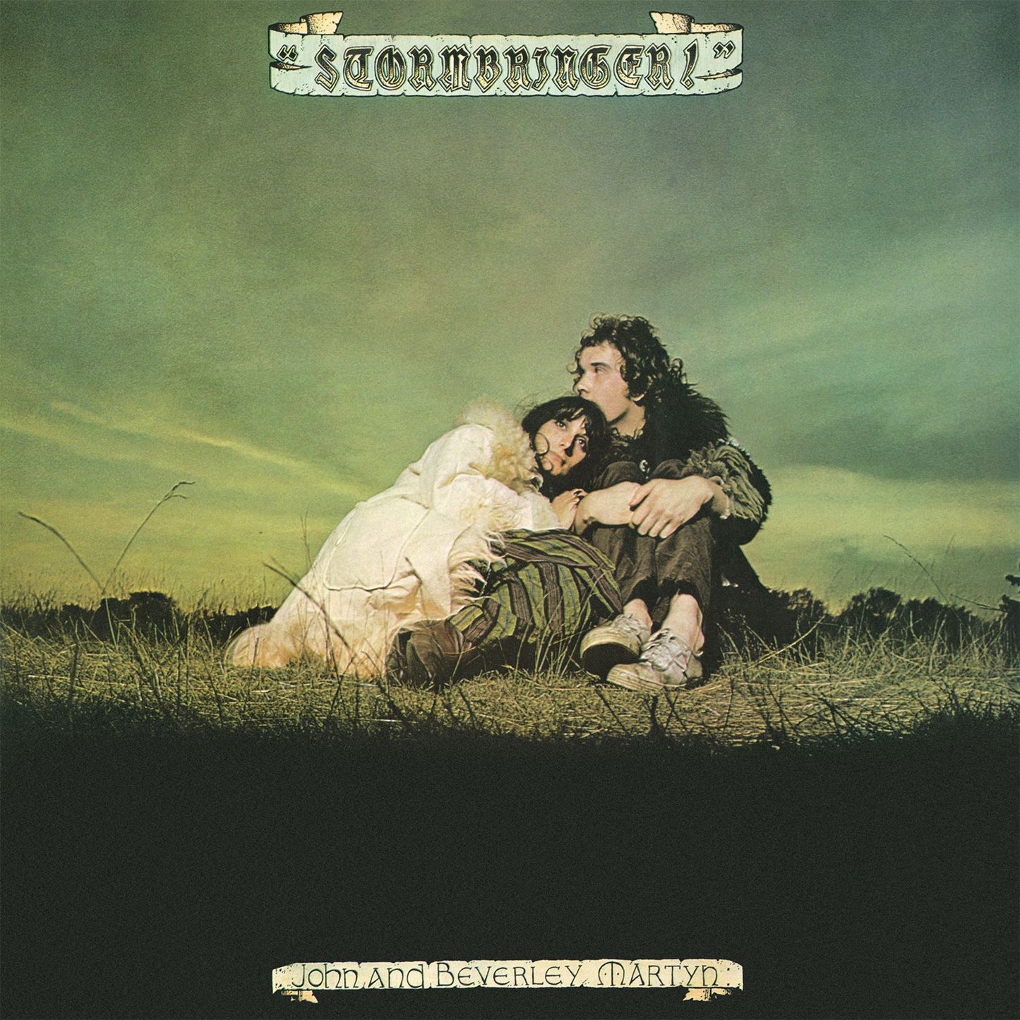 "Album cover with couple embracing in a field, green sky, 'Stormbringer!' title."