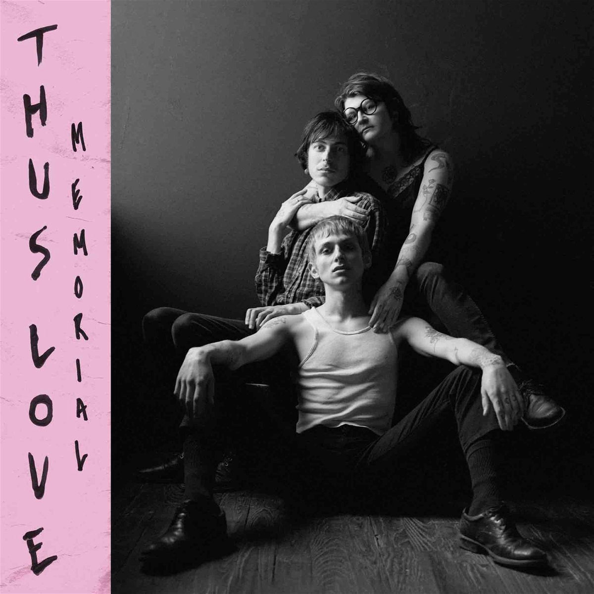 Three people posing, album cover for “Thus Love - Memorial.”