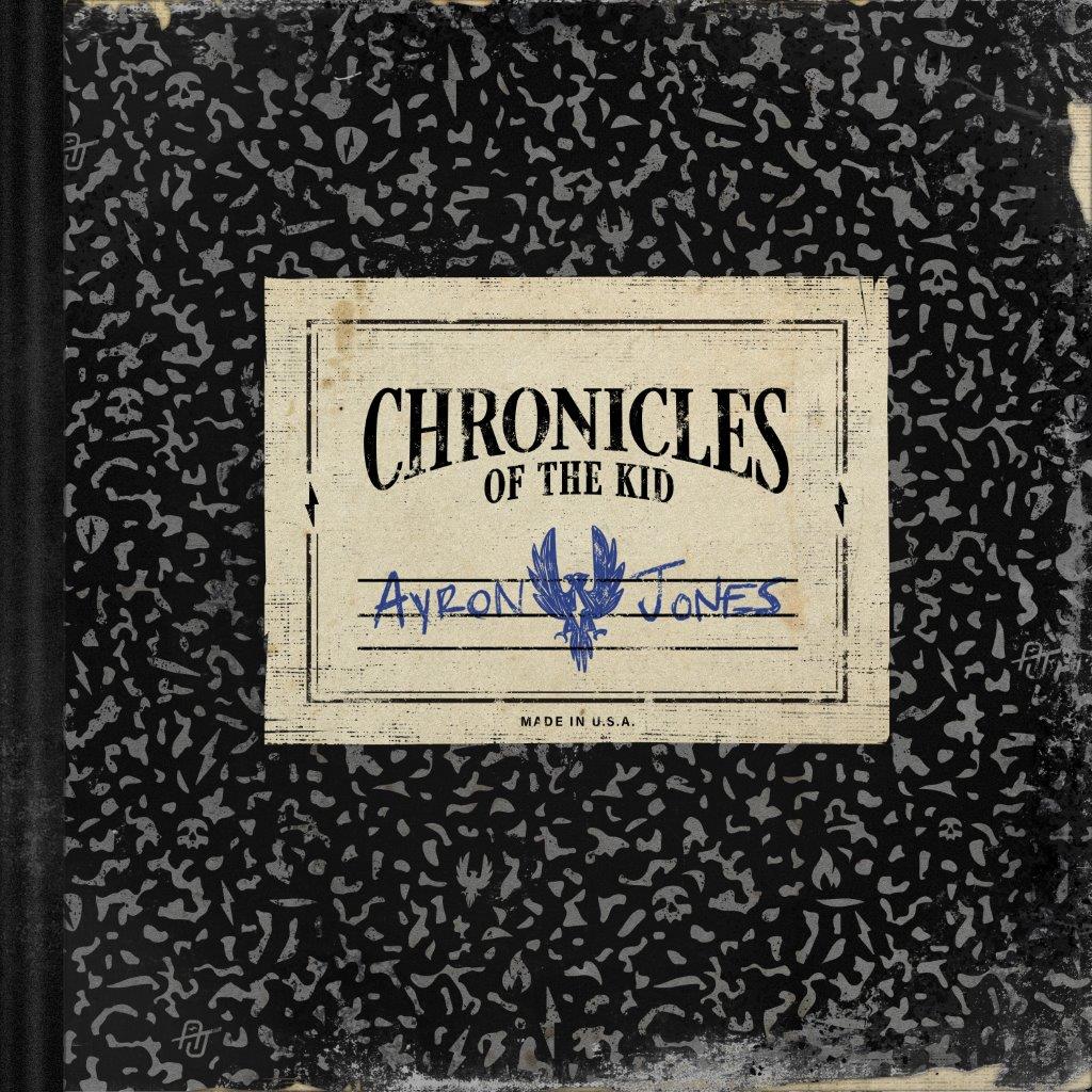 "Album cover with black background, grey patterns, and a vintage label featuring 'Chronicles of the Kid'."