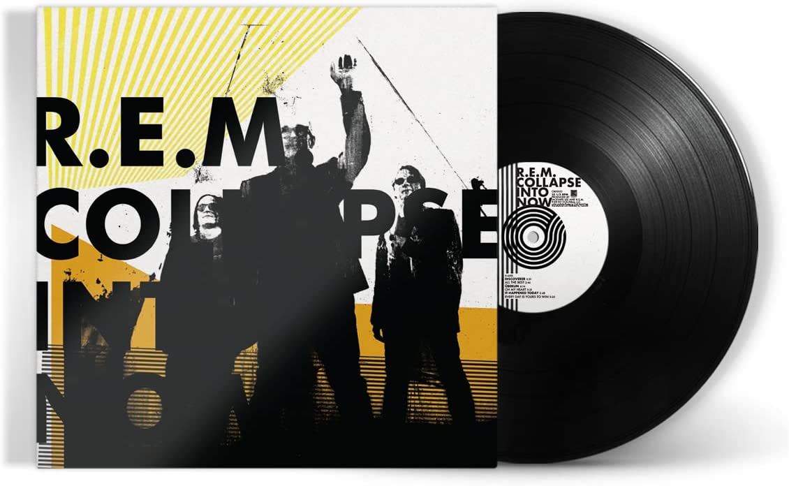 Vinyl record with cover art featuring silhouetted band members and yellow and white design.